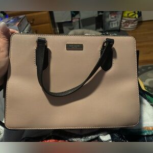 Kate spade light pink and black purse with long handle. Great condition.